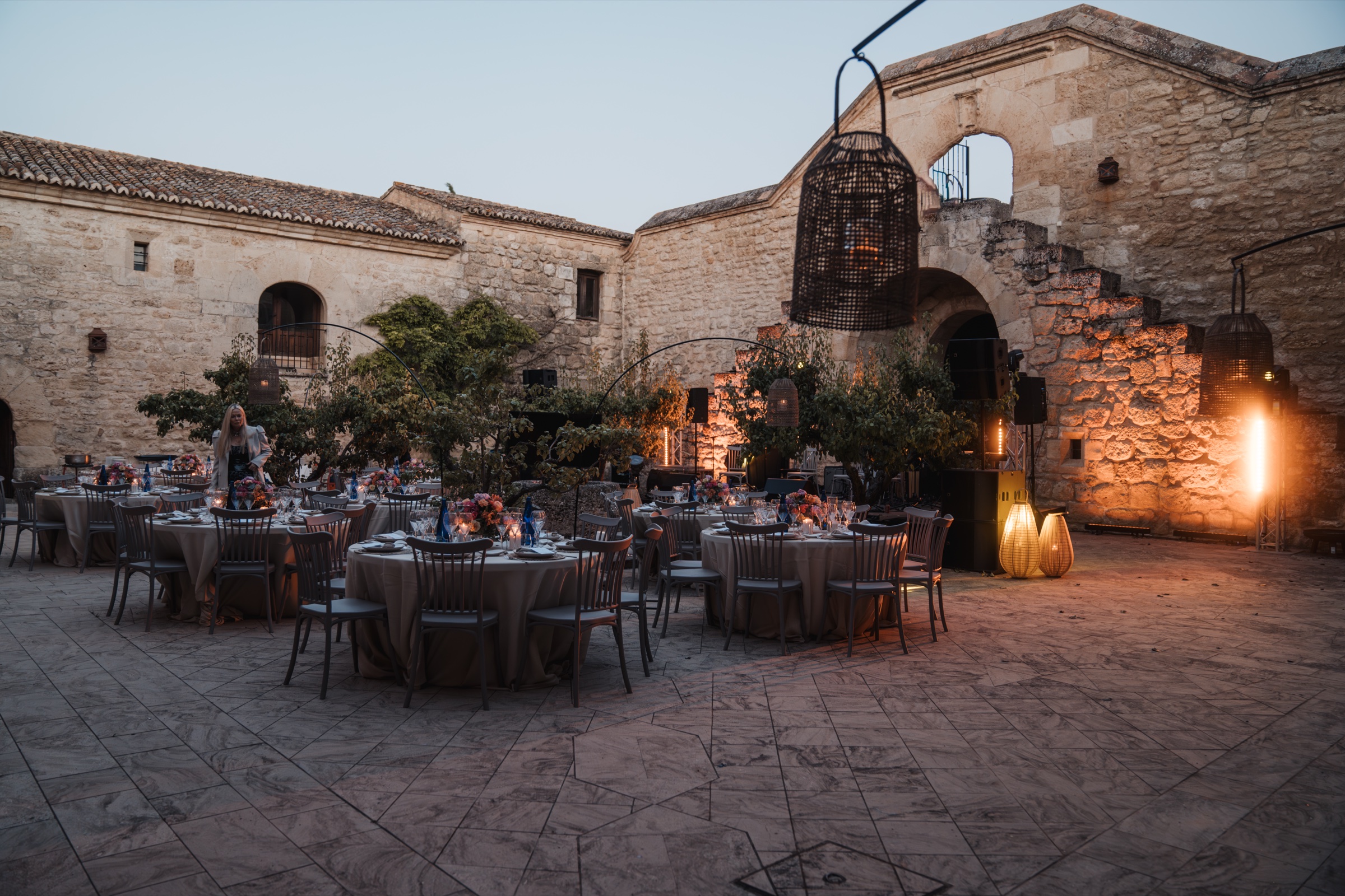 The courtyard set for a wedding dinner
