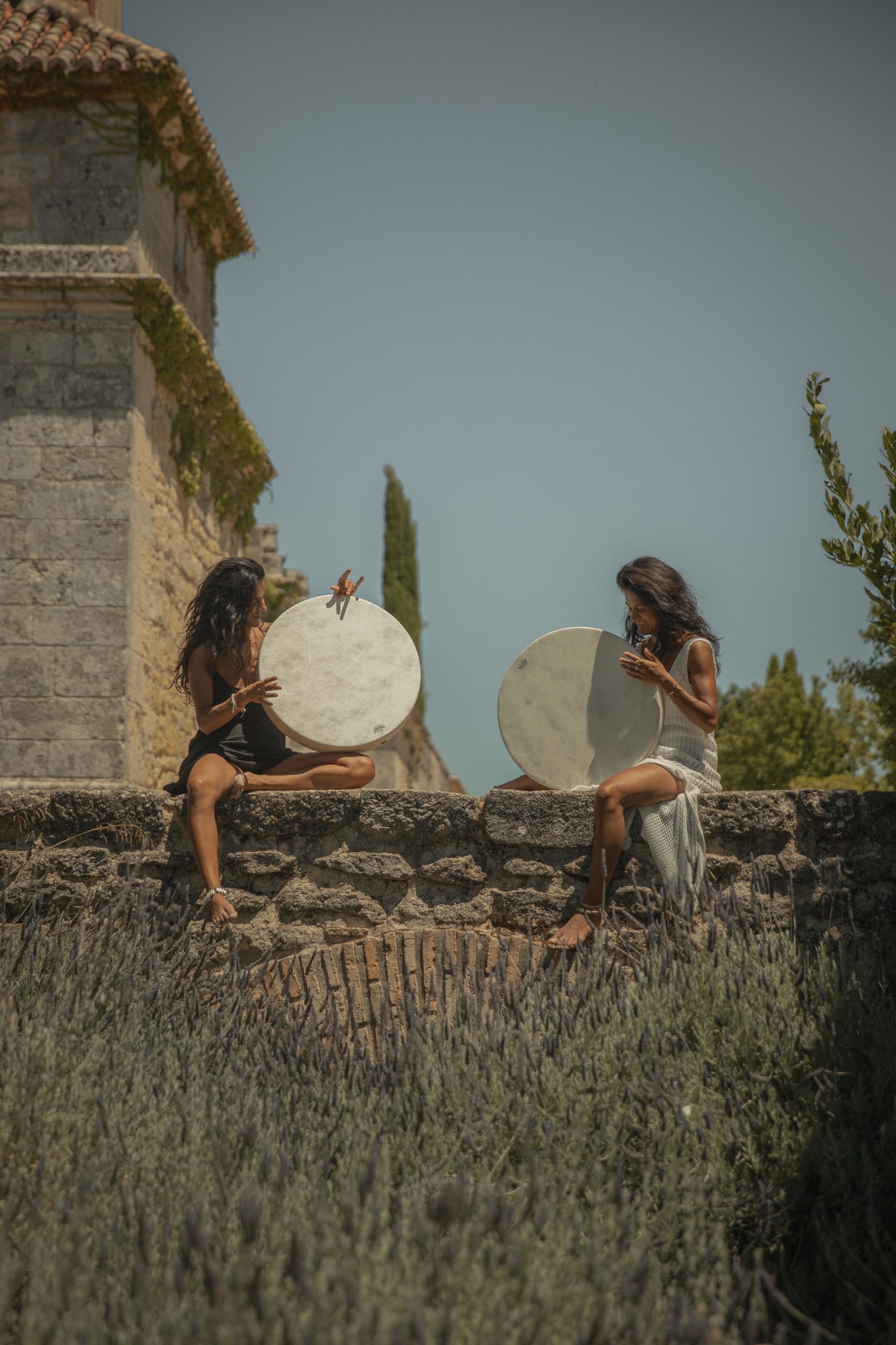 Two practitioners with frame drums